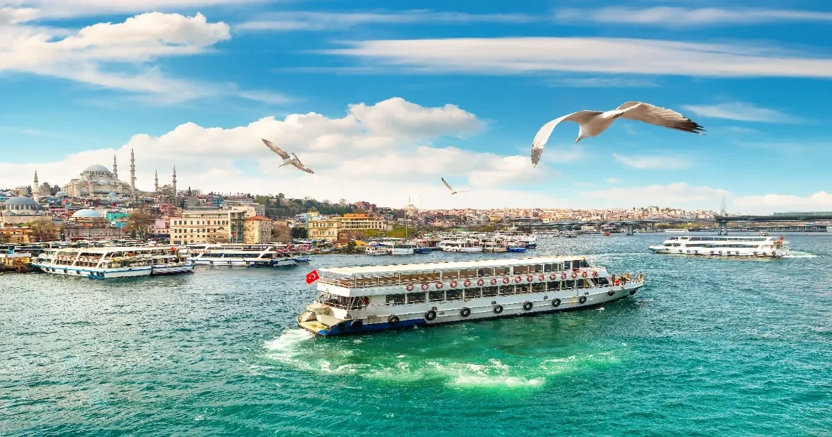Bosphorus cruise boats and Istanbul skyline