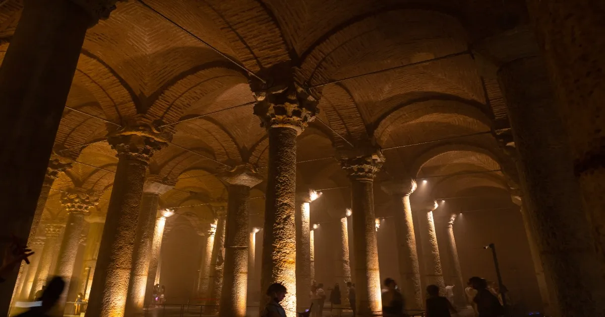 Illuminated columns and reflections inside the Basilica Cistern