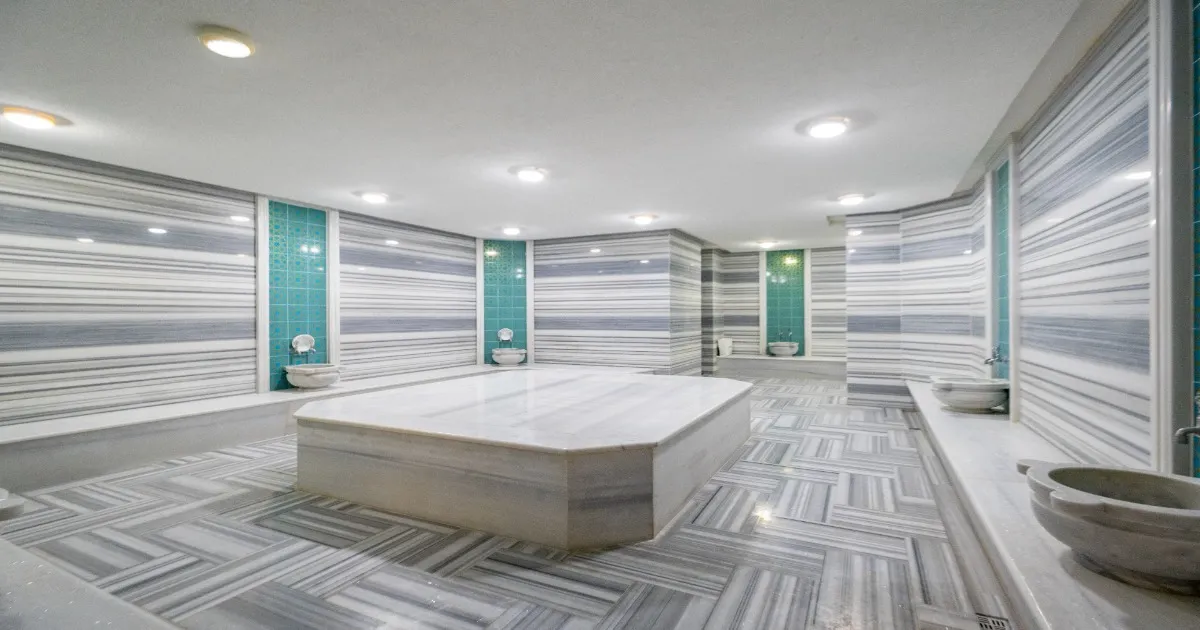 Traditional Turkish hammam interior with historic stone and marble details